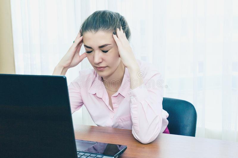 [Thumb - headache-workplace-restarting-work-stress-girl-holds-her-head-fatigue-161080408.jpg]
